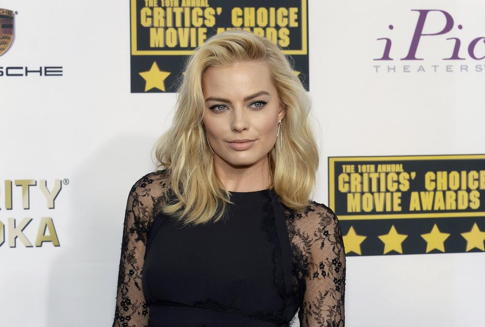 andrew graves add margot robbie frontal photo