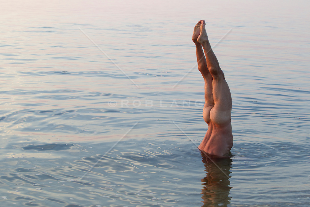 men naked underwater